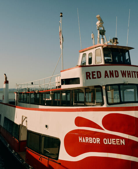 Red and White Fleet tour boat at pier.