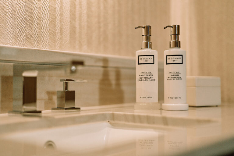 Beekman toiletries on modern bathroom counter.