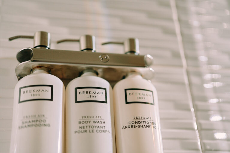 Mounted Beekman toiletries in shower