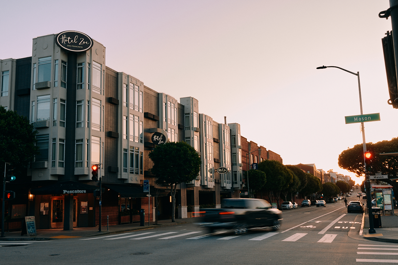 Street view of Hotel Zoe at sunset.