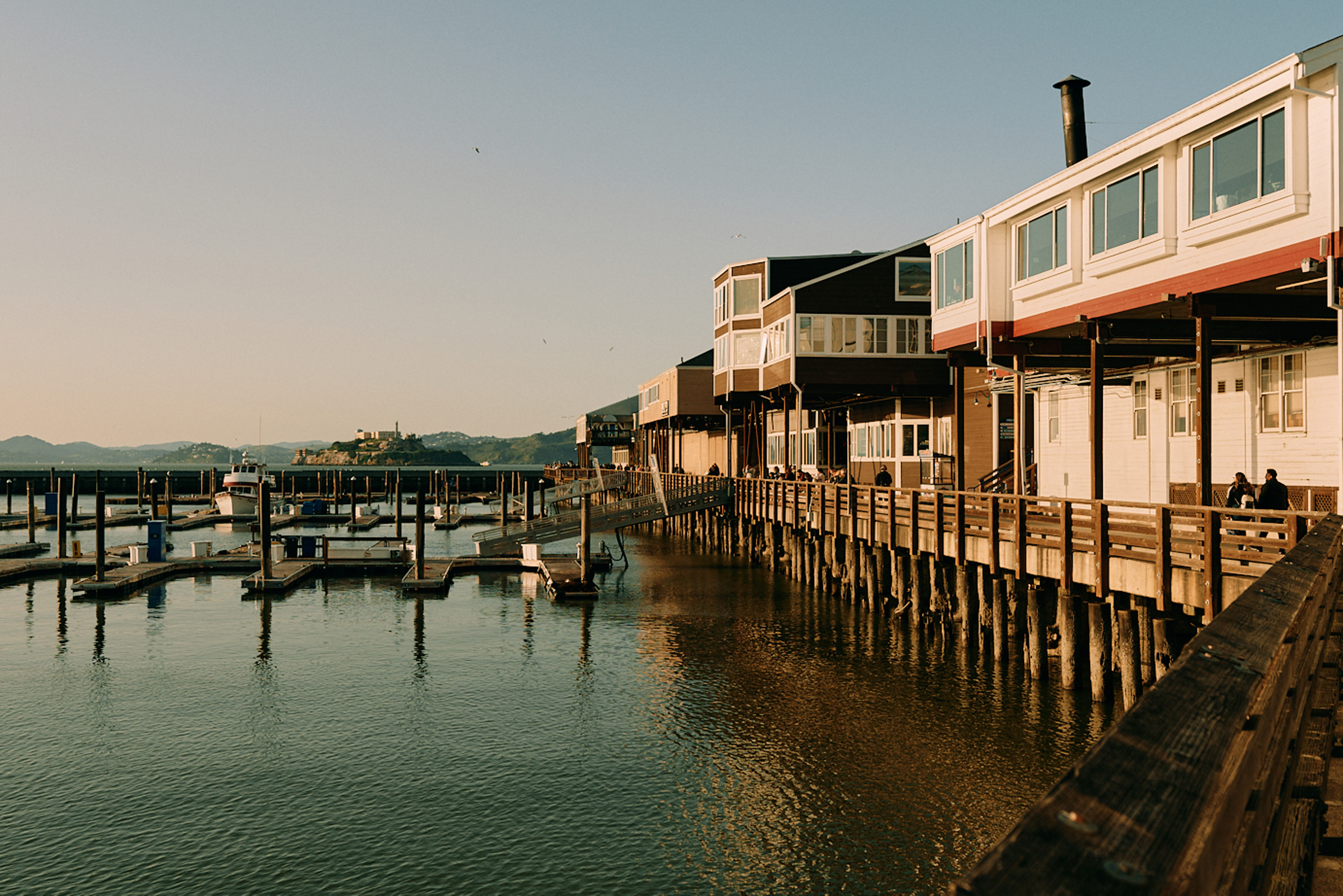 Pier 39 boardwalk overlooking marina.