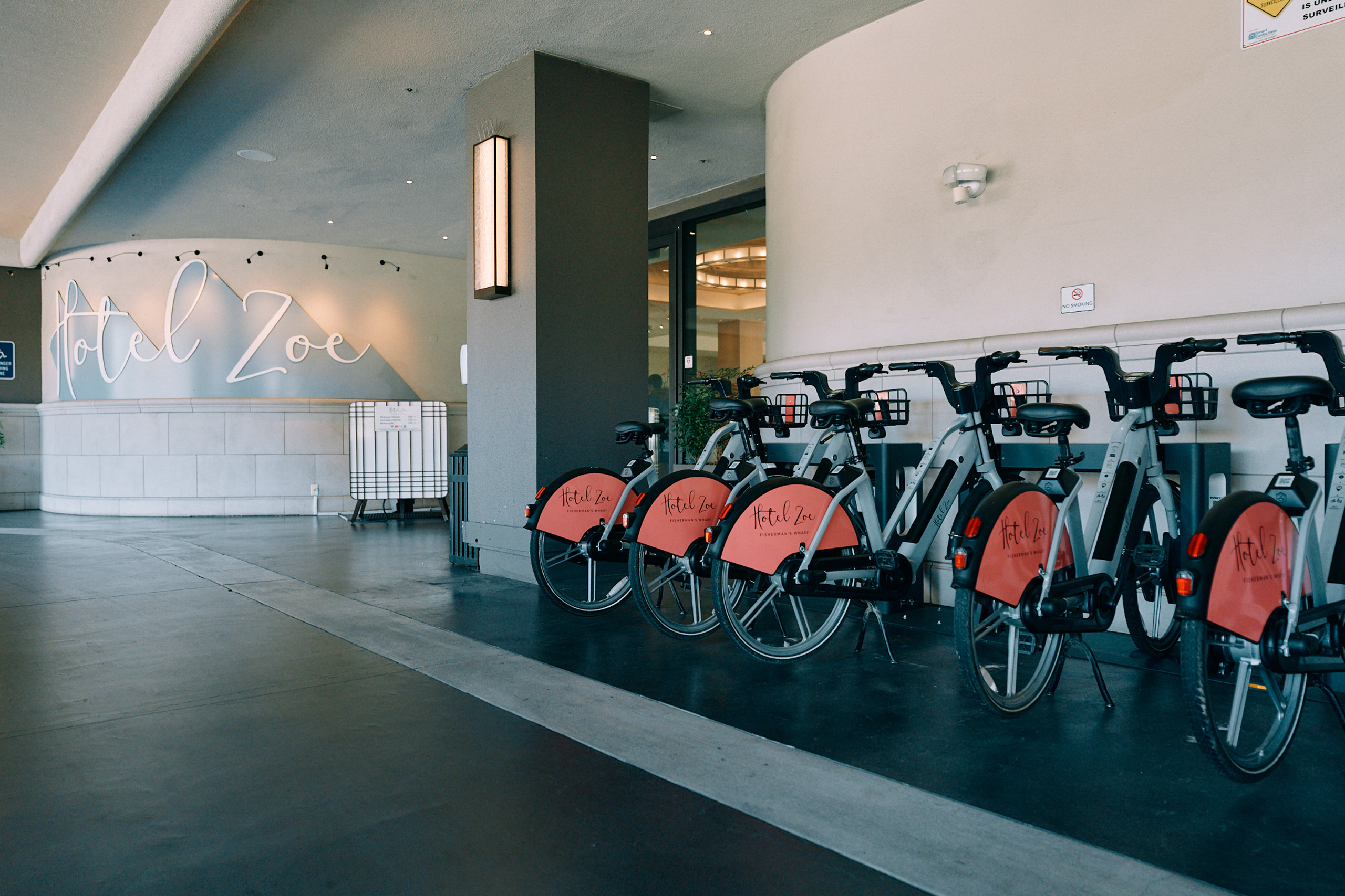 Hotel Zoe bicycles lined up near entrance for guests.