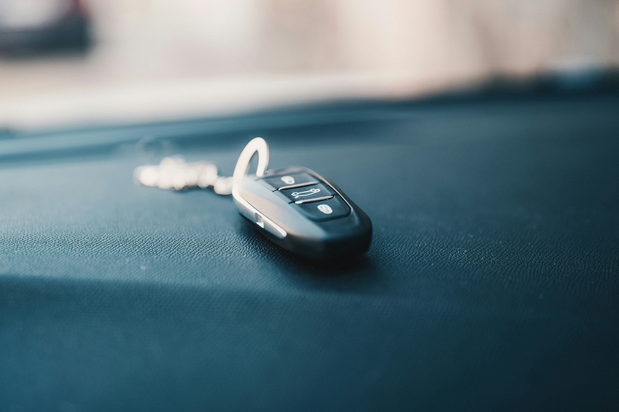 Car key resting on dashboard.