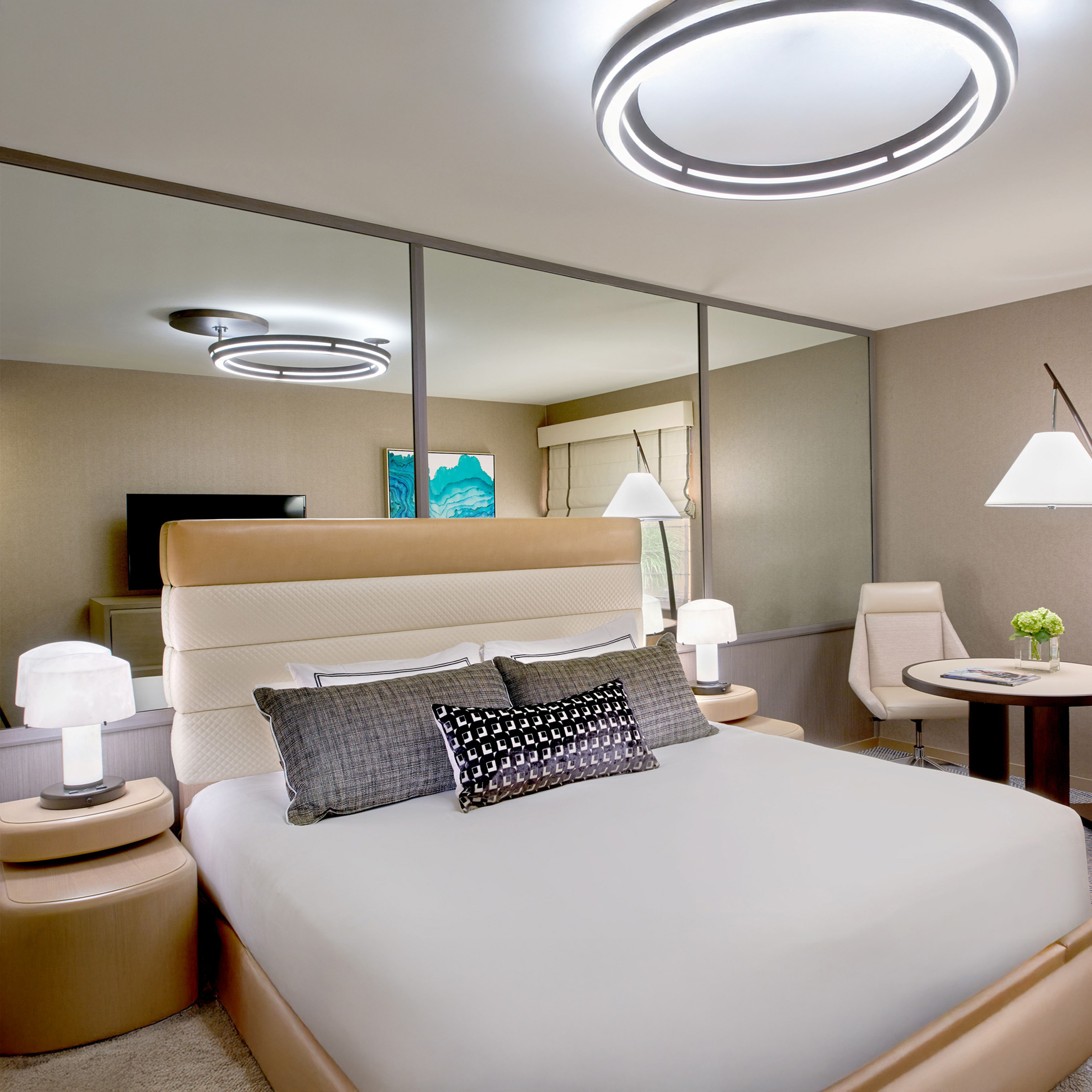 Bright bedroom with modern bed and seating area