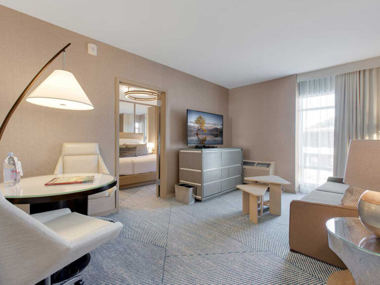 Spacious suite with seating and bedroom view