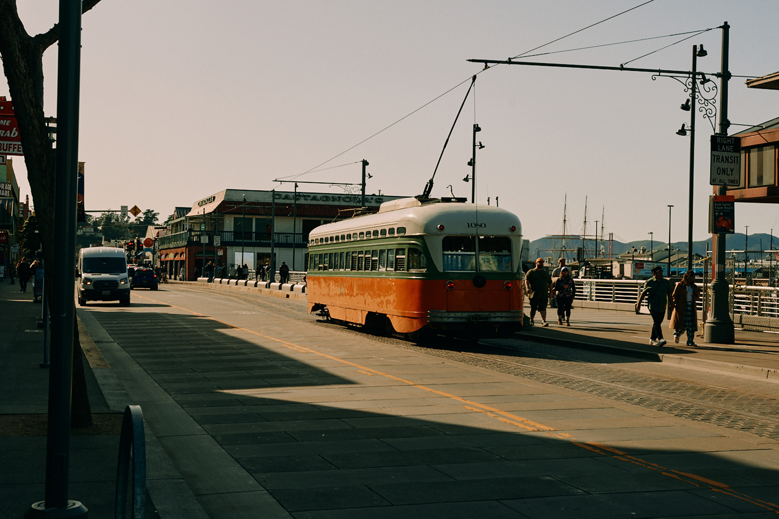 Historic streetcar along San Francisco waterfront promenade.